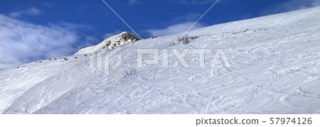 Off-piste slope with track from ski and snowboard Off-piste slope with track from ski and snowboard 57974126