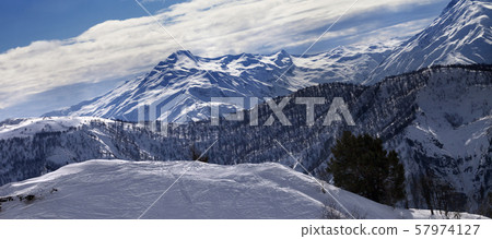 Off-piste slope and snow winter mountains in sun Off-piste slope and snow winter mountains in sun 57974127
