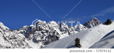 Off-piste slope with track from ski and snowboard Off-piste slope with track from ski and snowboard 57974132