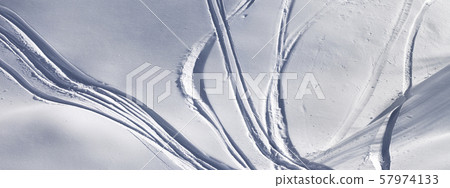 Off-piste slope with track from ski and snowboard Off-piste slope with track from ski and snowboard 57974133