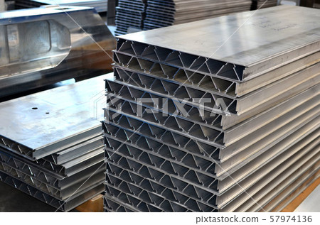 Aluminum profile in the production hall of an industrial plant.  57974136