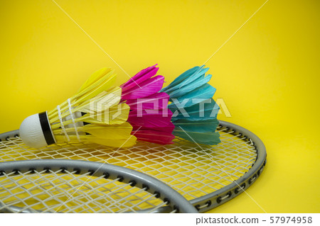 Colorful shuttlecocks and badminton rackets Colorful shuttlecocks and badminton rackets 57974958