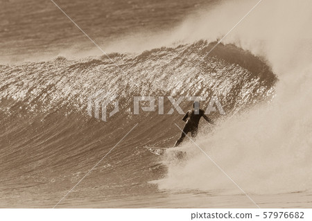 Surfer Surfing Rides Cold Wave Sepia Tone 57976682