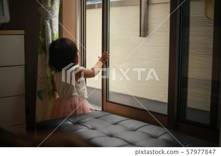 Girl trying to get out on the veranda Girl trying to get out on the veranda 57977847