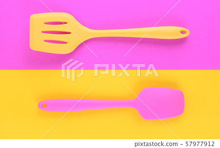 bright kitchen utensils on yellow and purple background, creative idea bright kitchen utensils on yellow and purple background, creative idea 57977912