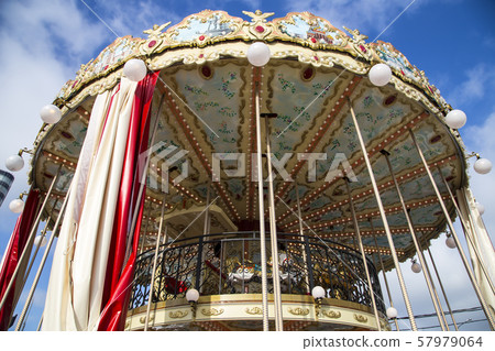 Old classic French vintage carousel in a holiday park. Moscow, Russia 57979064