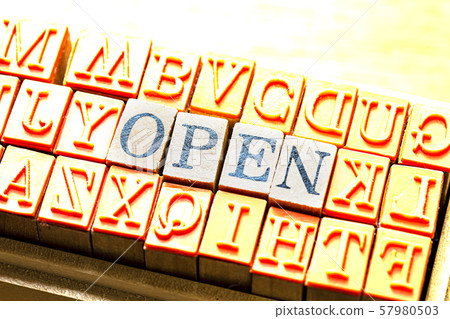 The character of the open sign placed on the wood grain The wood background Metallic made 57980503