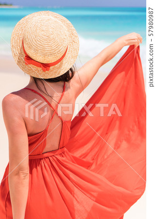 Young girl in beautiful red dress background the sea Young girl in beautiful red dress background the sea 57980987