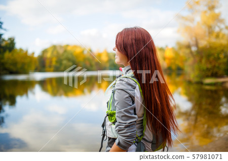 Image of smiling woman with backpack and bicycle helmet Image of smiling woman with backpack and bicycle helmet 57981071