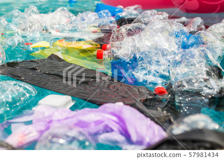 Plastic recycling, pollution and environmental concept - Environmental problem of plastic rubbish Plastic recycling, pollution and environmental concept - Environmental problem of plastic rubbish 57981434