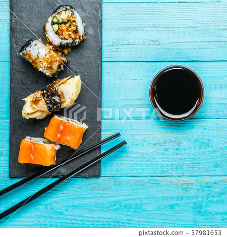 Japanese rolls on black board 57981653