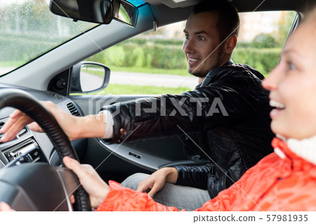 driving instructor urgently helps the student make driving instructor urgently helps the student make 57981935