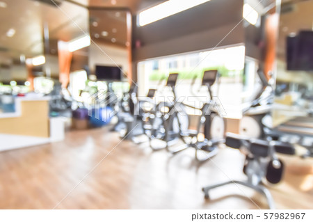 Blur gym background fitness center or health club with blurry sports exercise equipment for aerobic workout and bodybuilding 57982967