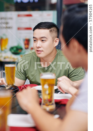 Men drinking beer Men drinking beer 57984165
