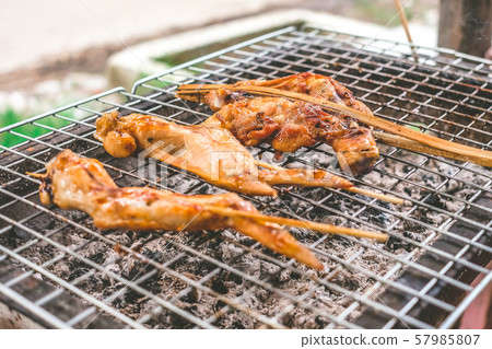 Close of up grilled chicken on the stove. 57985807