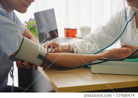 Close up doctors are measuring patients' pressure, Close up doctors are measuring patients' pressure, 57986474