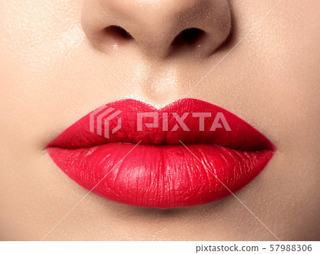 Close up view of beautiful woman lips Close up view of beautiful woman lips 57988306
