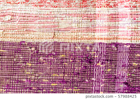 Handmade doormat from strips of cloth as 57988425