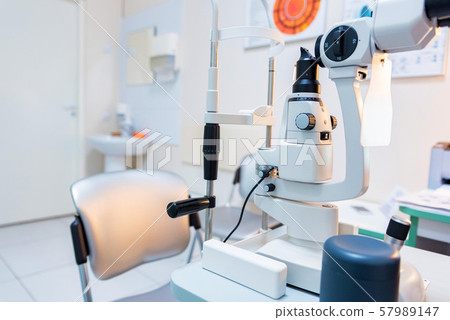 View of slit lamp on table in ophthalmologist room 57989147