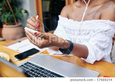 Woman writing her plans Woman writing her plans 57989254