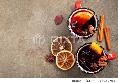 Two cups of autumn mulled wine or gluhwein. 57989765