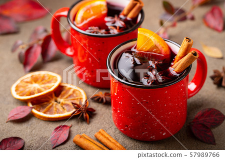 Two cups of autumn mulled wine or gluhwein. 57989766