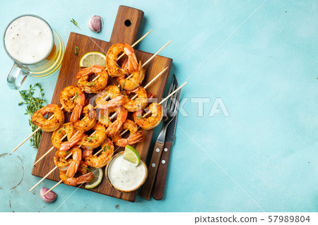Grilled shrimps or prawns served with lime. 57989804