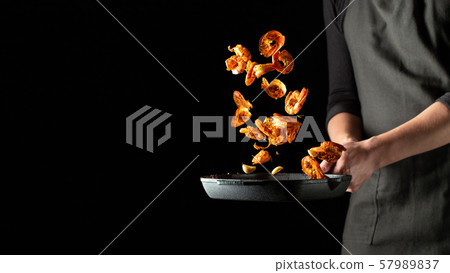 Professional chef prepares shrimps or langoustines 57989837