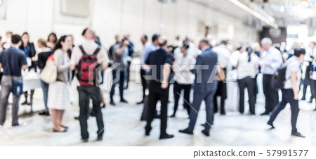 Blured image of businesspeople at coffee break at conference meeting. Blured image of businesspeople at coffee break at conference meeting. 57991577