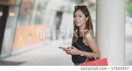 Portrait of beautiful woman smiling to the camera 57994847