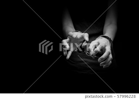 concept human trafficking, girl's hand in shackle on isolate black background concept human trafficking, girl's hand in shackle on isolate black background 57996228