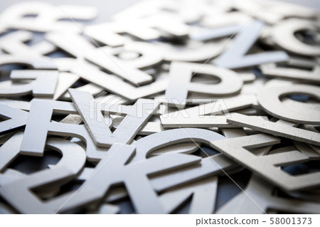 Mixed letters pile closeup photo Mixed letters pile closeup photo 58001373