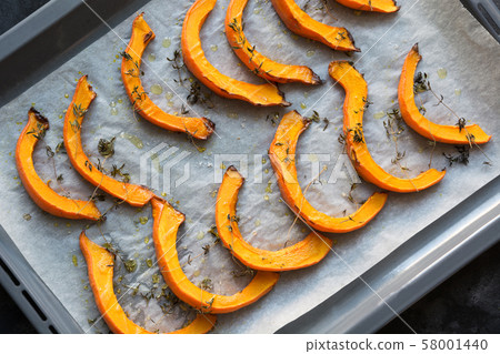 Hot roasted slices pumpkin with thyme, olive oil 58001440