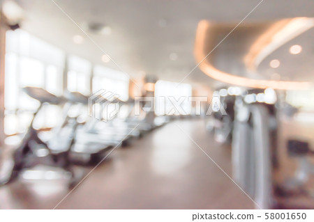 Blur gym background fitness center or health club with blurry sports exercise equipment for aerobic workout and bodybuilding Blur gym background fitness center or health club with blurry sports exercise equipment for aerobic workout and bodybuilding 58001650