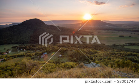 Beautiful Hungarian sunset with old volcanoes near 58001747
