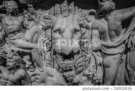 Ancient lion head relief on the wall. Mythology stone art bas-relief. Uvarov sarcophagus dating from Ancient lion head relief on the wall. Mythology stone art bas-relief. Uvarov sarcophagus dating from 58002656