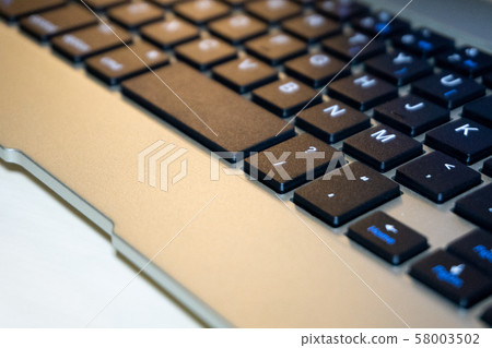 Closeup of laptop keyboard with selective focus Closeup of laptop keyboard with selective focus 58003502