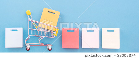 Shopping anniversary flat blue background Shopping Cart flat lay shopping 58005874