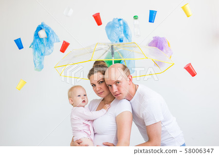 Environmental pollution, plastic recycling problem and waste disposal concept - surprised family Environmental pollution, plastic recycling problem and waste disposal concept - surprised family 58006347