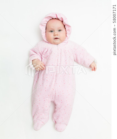 Cute baby dressed in warm overall for winter cold weather. Cute baby dressed in warm overall for winter cold weather. 58007171