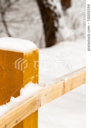railing bridge pillar snow-covered close-up railing bridge pillar snow-covered close-up 58008394
