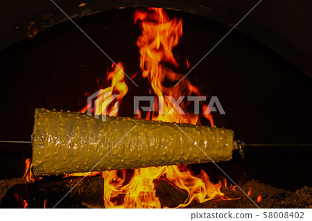 Christmas shakotis cake is prepared on an open 58008402
