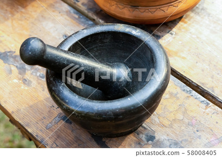 pharmacist grinding ingredients stone mortar 58008405