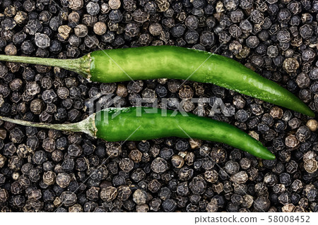 top view of chili pepper green pod closeup black top view of chili pepper green pod closeup black 58008452
