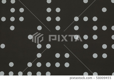 Matte black wall with large scattered dots on it 58009455