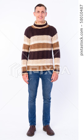 Full body shot of happy man smiling ready for winter 58010487