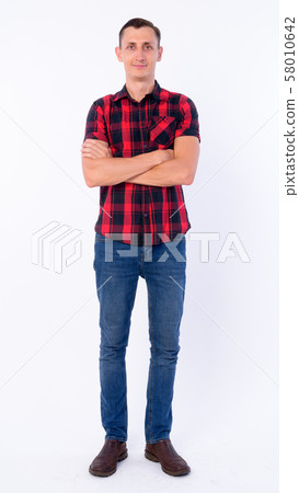 Full body shot of hipster man with arms crossed Full body shot of hipster man with arms crossed 58010642