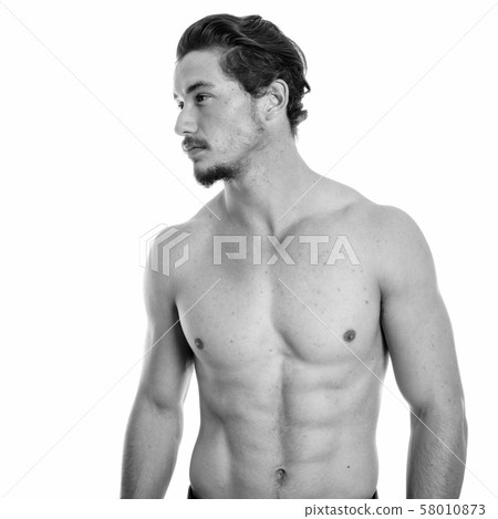 Profile view of young handsome man thinking shirtless isolated against white background 58010873