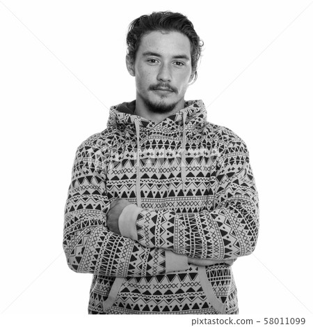 Studio shot of young handsome man with arms crossed isolated against white background 58011099