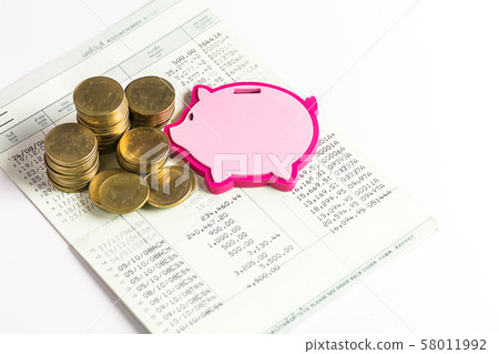 Gold coins with piggy bank shaped and book bank on Gold coins with piggy bank shaped and book bank on 58011992